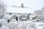 Thatched house in winter