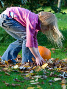 Girl with autumn leaves